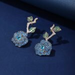 Wholesale snake zircon earrings with white pave stones on real gold plated copper from JuneJewelry.com – unique serpent fashion jewelry for bulk orders.