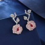 Wholesale snake zircon earrings with white pave stones on real gold plated copper from JuneJewelry.com – unique serpent fashion jewelry for bulk orders.