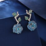 Wholesale snake zircon earrings with white pave stones on real gold plated copper from JuneJewelry.com – unique serpent fashion jewelry for bulk orders.