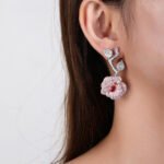 Wholesale snake zircon earrings with white pave stones on real gold plated copper from JuneJewelry.com – unique serpent fashion jewelry for bulk orders.