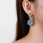 Wholesale snake zircon earrings with white pave stones on real gold plated copper from JuneJewelry.com – unique serpent fashion jewelry for bulk orders.