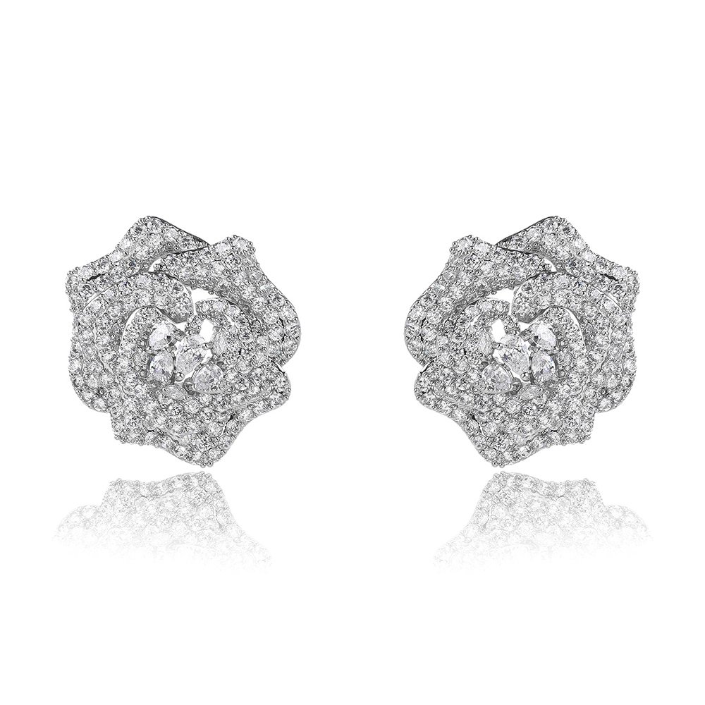 CE12157.181.A Wholesale floral zircon earrings with white pavé petals on real gold plated copper from JuneJewelry.com – luxury blossom studs for bulk orders.