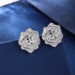 Wholesale floral zircon earrings with white pavé petals on real gold plated copper from JuneJewelry.com – luxury blossom studs for bulk orders.