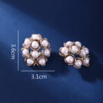 Wholesale shell pearl earrings with zircon stones and gold plated copper floral design from JuneJewelry.com – 925 silver needle fashion jewelry for bulk buyers.