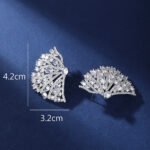 Wholesale pink flower earrings with central yellow zircon and 925 silver needles from JuneJewelry.com – unique floral brass jewelry for bulk buyers.