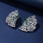 Wholesale pink flower earrings with central yellow zircon and 925 silver needles from JuneJewelry.com – unique floral brass jewelry for bulk buyers.