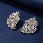 Wholesale pink flower earrings with central yellow zircon and 925 silver needles from JuneJewelry.com – unique floral brass jewelry for bulk buyers.