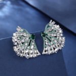 Wholesale pink flower earrings with central yellow zircon and 925 silver needles from JuneJewelry.com – unique floral brass jewelry for bulk buyers.