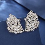 Wholesale pink flower earrings with central yellow zircon and 925 silver needles from JuneJewelry.com – unique floral brass jewelry for bulk buyers.