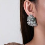 Wholesale pink flower earrings with central yellow zircon and 925 silver needles from JuneJewelry.com – unique floral brass jewelry for bulk buyers.