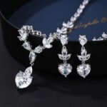 Wholesale copper zircon jewelry set with marquise and heart-cut stones, real gold plated copper from JuneJewelry.com – premium bridal accessories for bulk orders.