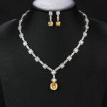 Wholesale luxury zircon set with necklace and S925 silver needle earrings in gold plated copper from JuneJewelry.com – high-quality bridal jewelry for bulk orders.