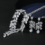 Wholesale copper zircon set featuring a large oval pendant and matching earrings in real gold plating from JuneJewelry.com for bulk boutique orders.