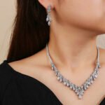 Wholesale copper zircon set with marquise stones and real gold plating from JuneJewelry.com – luxury bridal jewelry for bulk orders.