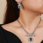 Wholesale copper zircon jewelry set with real gold plating and 925 silver needle earrings from JuneJewelry.com – luxury bridal accessories for bulk orders.