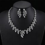 Wholesale zircon jewelry sets featuring teardrop and marquise cut stones in 18K gold plated copper from JuneJewelry.com – luxury bridal accessories for bulk purchase.