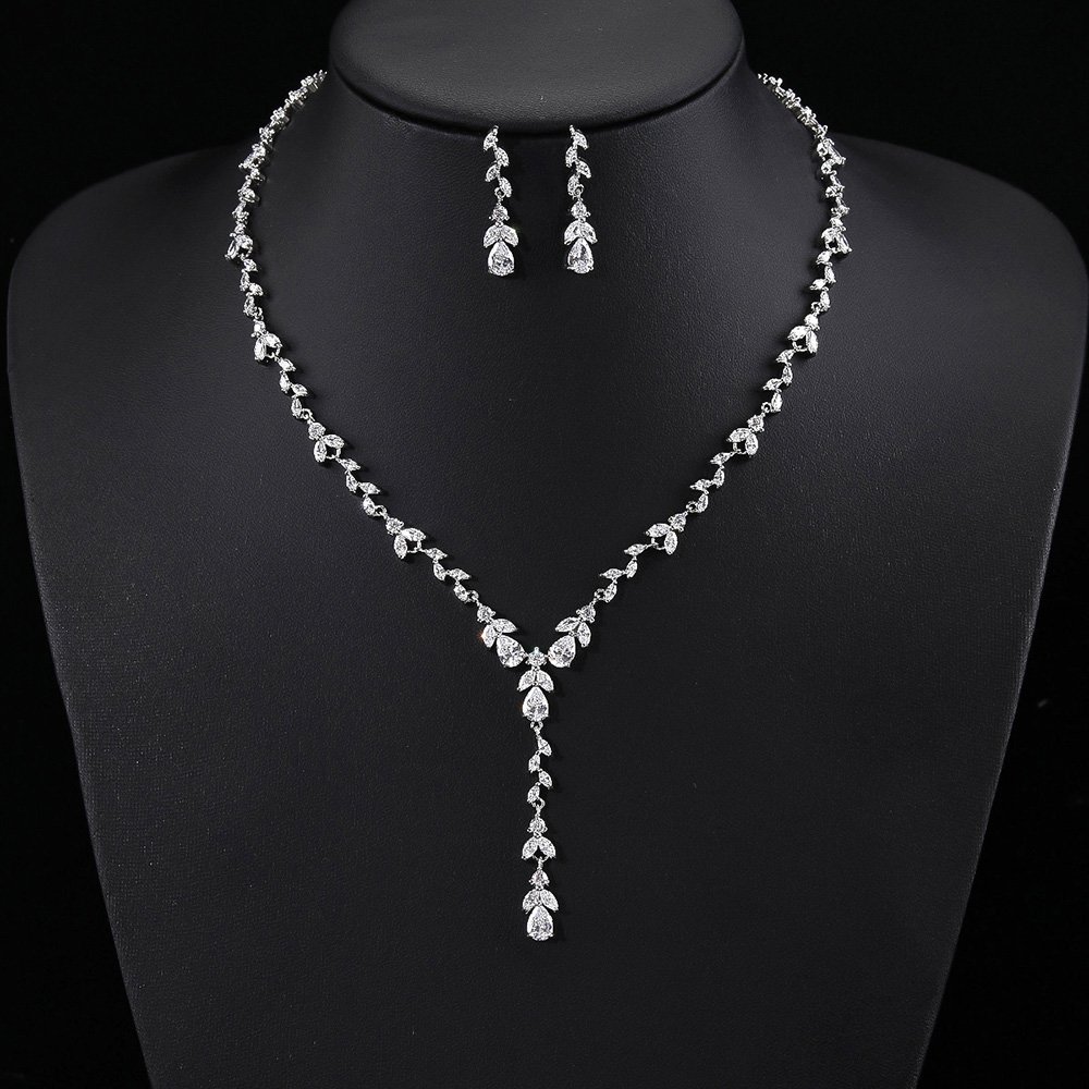 CN10840.385.A Wholesale copper zircon jewelry set with marquise-cut stones and real gold plating from JuneJewelry.com – luxury bridal accessories for bulk orders.