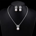 Wholesale snowflake jewelry set with shell pearls and zircon stones on 18K gold plated copper from JuneJewelry.com – luxury 925 silver needle bridal jewelry.