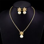 Wholesale snowflake jewelry set with shell pearls and zircon stones on 18K gold plated copper from JuneJewelry.com – luxury 925 silver needle bridal jewelry.