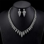 Wholesale elegant zircon set with leaf pattern and real gold plating on copper from JuneJewelry.com – premium bridal jewelry for bulk buyers.