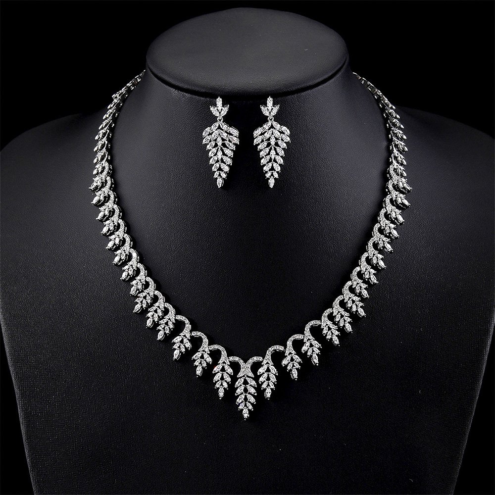 CN11037.495.A Wholesale elegant zircon set with leaf pattern and real gold plating on copper from JuneJewelry.com – premium bridal jewelry for bulk buyers.