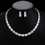 Wholesale emerald cut zircon set with radiant white stones and 18K gold plated copper from JuneJewelry.com – luxury 925 silver needle jewelry.