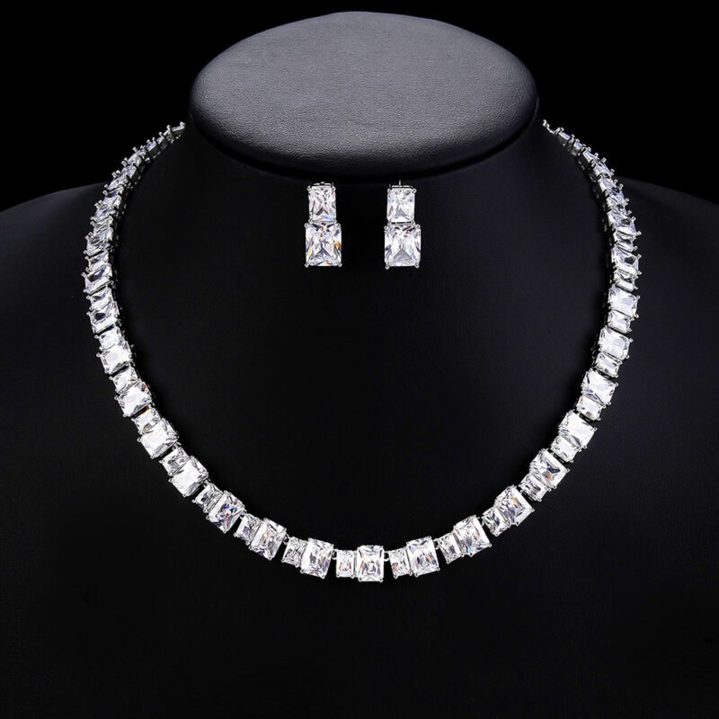 Wholesale emerald cut zircon set with radiant white stones and 18K gold plated copper from JuneJewelry.com – luxury 925 silver needle jewelry.