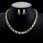 Wholesale emerald cut zircon set with radiant white stones and 18K gold plated copper from JuneJewelry.com – luxury 925 silver needle jewelry.