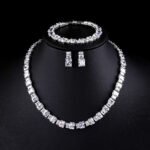 Wholesale luxury zircon set with emerald cut radiant stones and gold plated copper from JuneJewelry.com – 925 silver needle jewelry.