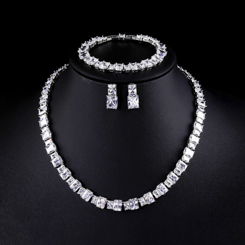 Wholesale luxury zircon set with emerald cut radiant stones and gold plated copper from JuneJewelry.com – 925 silver needle jewelry.