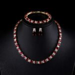 Wholesale luxury zircon set with emerald cut radiant stones and gold plated copper from JuneJewelry.com – 925 silver needle jewelry.