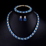 Wholesale luxury zircon set with emerald cut radiant stones and gold plated copper from JuneJewelry.com – 925 silver needle jewelry.