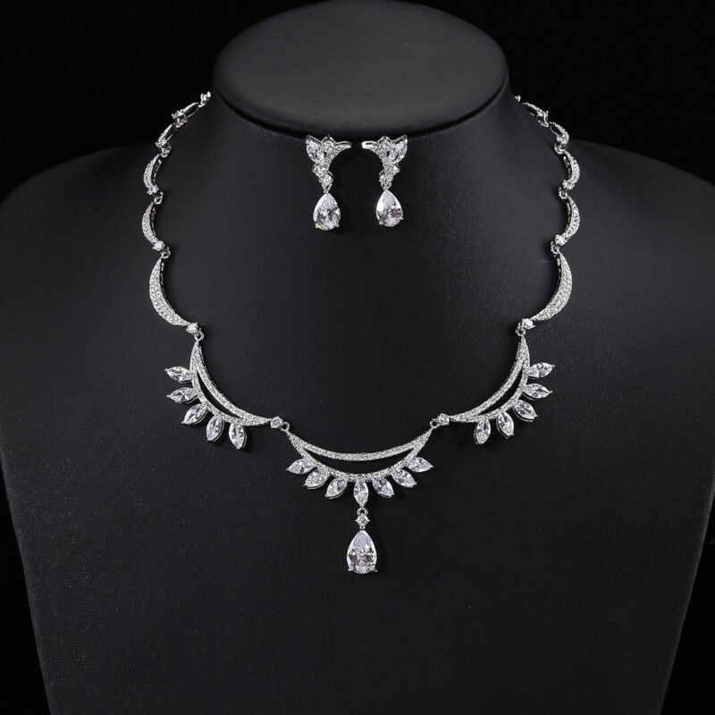 Wholesale bridal zircon set with teardrop stones and platinum plated copper from JuneJewelry.com – luxury wedding jewelry for bulk purchase.