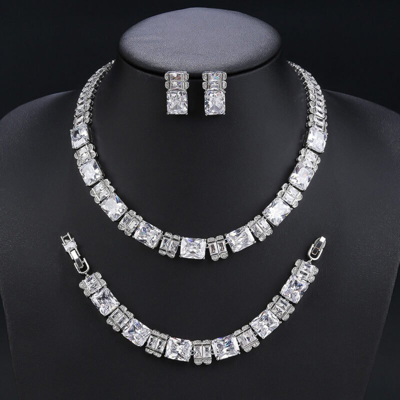 Wholesale radiant zircon set with emerald cut stones and gold plated copper from JuneJewelry.com – luxury 925 silver needle bridal jewelry.