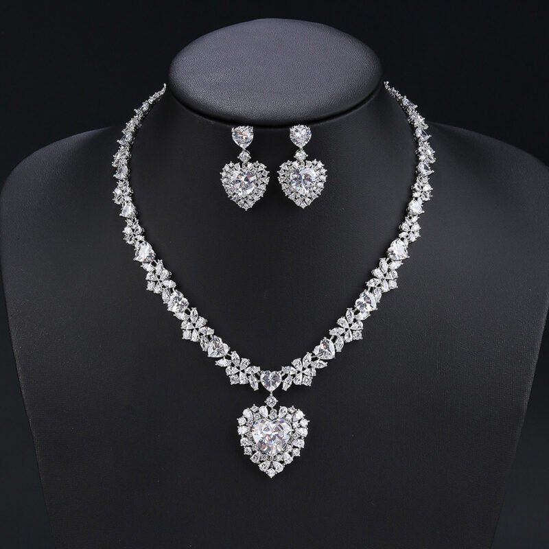 Wholesale cubic zirconia set with oval and pear-cut stones on real gold plated copper base from JuneJewelry.com – luxury bridal jewelry for bulk orders.