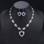 Wholesale cubic zirconia set with oval and pear-cut stones on real gold plated copper base from JuneJewelry.com – luxury bridal jewelry for bulk orders.