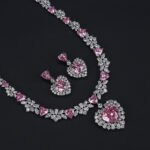 Wholesale cubic zirconia set with oval and pear-cut stones on real gold plated copper base from JuneJewelry.com – luxury bridal jewelry for bulk orders.