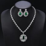 Elevate your luxury collection with our Wholesale Bridal Zircon Set, designed specifically for premium wedding boutiques and retailers. We utilize high-grade copper as the durable foundation for these shimmering necklace and earring ensembles. Our skilled artisans apply genuine gold plating to ensure a long-lasting, brilliant white gold finish. Each piece sparkles with hand-set AAA grade cubic zircon stones that capture light from every angle. We include hypoallergenic 925 silver needles on all earrings to protect your customers' sensitive skin. Exquisite Original Designs for Grand Occasions The Wholesale Bridal Zircon Set represents the pinnacle of original craftsmanship for formal gala events. We feature intricate geometric patterns and teardrop accents in these unique jewelry combinations. These sets offer a sophisticated aesthetic that rivals fine diamond jewelry at a fraction of the cost. Your clients will love the heavy, high-quality feel of these stunning accessories. We create these designs to help your brand stand out in the competitive bridal market. Maximize Profits with Direct Factory Pricing At JuneJewelry.com, we provide the Wholesale Bridal Zircon Set at unbeatable factory-direct prices. Our professional manufacturing process ensures that you receive high-quality goods for your bulk orders. We eliminate middleman fees to help you achieve significantly higher profit margins on every sale. This jewelry is perfect for cross-border e-commerce sellers on platforms like Amazon or Shopify. You can trust our consistent quality and unique style to keep your inventory moving quickly. Global Free Shipping and Professional Support Ordering our Wholesale Bridal Zircon Set is completely worry-free thanks to our global free shipping policy. We ship your items securely to ensure they arrive in perfect condition at your doorstep. Our team is dedicated to supporting jewelry wholesalers and online influencers with reliable supply chains. We focus on providing trendy, high-end pieces that resonate with modern fashion lovers. Partner with JuneJewelry today to expand your business with the finest zircon jewelry sets available.