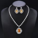 Elevate your luxury collection with our Wholesale Bridal Zircon Set, designed specifically for premium wedding boutiques and retailers. We utilize high-grade copper as the durable foundation for these shimmering necklace and earring ensembles. Our skilled artisans apply genuine gold plating to ensure a long-lasting, brilliant white gold finish. Each piece sparkles with hand-set AAA grade cubic zircon stones that capture light from every angle. We include hypoallergenic 925 silver needles on all earrings to protect your customers' sensitive skin. Exquisite Original Designs for Grand Occasions The Wholesale Bridal Zircon Set represents the pinnacle of original craftsmanship for formal gala events. We feature intricate geometric patterns and teardrop accents in these unique jewelry combinations. These sets offer a sophisticated aesthetic that rivals fine diamond jewelry at a fraction of the cost. Your clients will love the heavy, high-quality feel of these stunning accessories. We create these designs to help your brand stand out in the competitive bridal market. Maximize Profits with Direct Factory Pricing At JuneJewelry.com, we provide the Wholesale Bridal Zircon Set at unbeatable factory-direct prices. Our professional manufacturing process ensures that you receive high-quality goods for your bulk orders. We eliminate middleman fees to help you achieve significantly higher profit margins on every sale. This jewelry is perfect for cross-border e-commerce sellers on platforms like Amazon or Shopify. You can trust our consistent quality and unique style to keep your inventory moving quickly. Global Free Shipping and Professional Support Ordering our Wholesale Bridal Zircon Set is completely worry-free thanks to our global free shipping policy. We ship your items securely to ensure they arrive in perfect condition at your doorstep. Our team is dedicated to supporting jewelry wholesalers and online influencers with reliable supply chains. We focus on providing trendy, high-end pieces that resonate with modern fashion lovers. Partner with JuneJewelry today to expand your business with the finest zircon jewelry sets available.