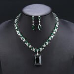 Wholesale emerald zircon set with large radiant center stone and gold plated copper from JuneJewelry.com – high-quality 925 silver needle jewelry.