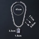 Wholesale emerald zircon set with large radiant center stone and gold plated copper from JuneJewelry.com – high-quality 925 silver needle jewelry.