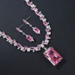 Wholesale emerald zircon set with large radiant center stone and gold plated copper from JuneJewelry.com – high-quality 925 silver needle jewelry.