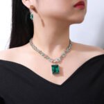 Wholesale emerald zircon set with large radiant center stone and gold plated copper from JuneJewelry.com – high-quality 925 silver needle jewelry.