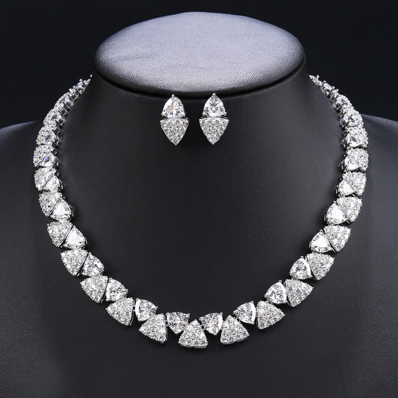 Wholesale triangle zircon set with radiant white stones and gold plated copper from JuneJewelry.com – luxury 925 silver needle bridal jewelry.