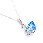 Elegant Swarovski element swan crystal necklace with a teardrop shape pendant in high-quality gold plated copper for wholesale fashion jewelry stores.