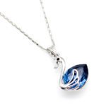 Elegant Swarovski element swan crystal necklace with a teardrop shape pendant in high-quality gold plated copper for wholesale fashion jewelry stores.