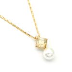 Modern square Swarovski element crystal and white pearl pendant necklace in gold and platinum plated copper for wholesale on junejewelry.com.