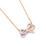 Cute Swarovski element bowknot pendant necklace in white gold and rose gold plating, unique fashion jewelry wholesale from junejewelry.com.