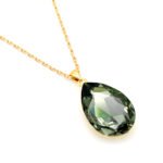 Elegant teardrop-shaped Swarovski element crystal pendant necklace with white gold plating, available for fashion jewelry wholesale at junejewelry.com.