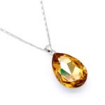 Elegant teardrop-shaped Swarovski element crystal pendant necklace with white gold plating, available for fashion jewelry wholesale at junejewelry.com.